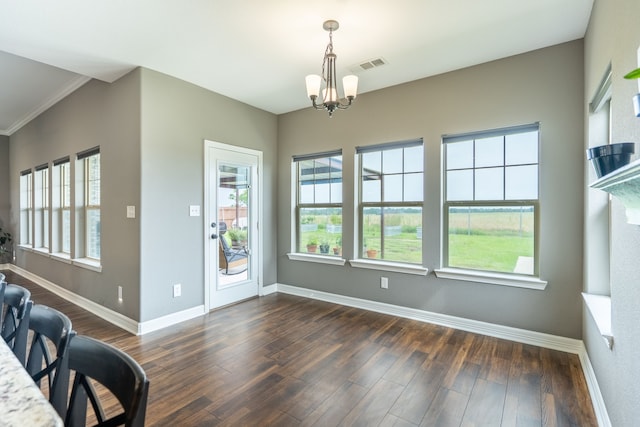 2503 Hollon Dr, Caddo Mills, TX 75135 - dining area featuring baseboards, dark wood finished floors, a chandelier, and ornamental molding
