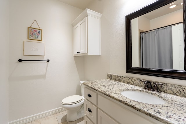 2503 Hollon Dr, Caddo Mills, TX 75135 - full bathroom with vanity, toilet, baseboards, and tile patterned floors
