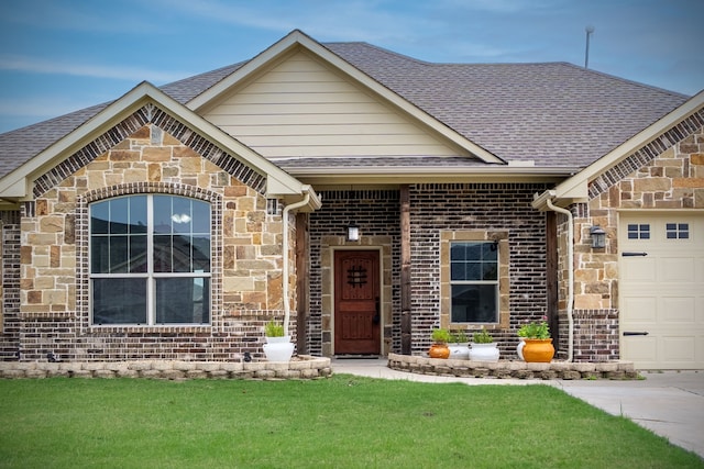 2503 Hollon Dr, Caddo Mills, TX 75135 - view of front of property featuring an attached garage, stone siding, and a shingled roof