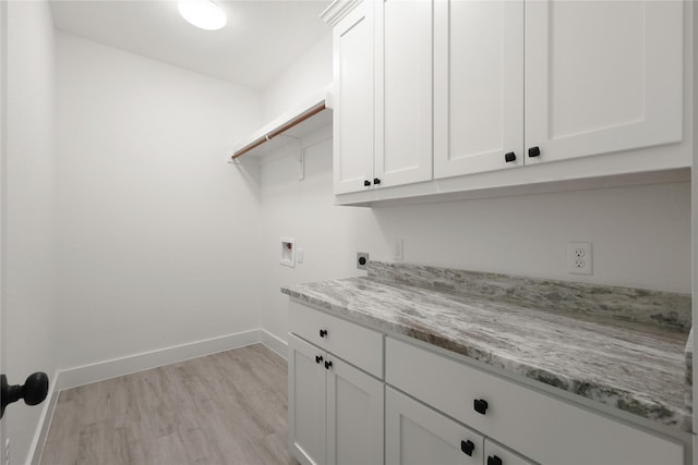 220 E 7th St, Weatherford, TX 76086 - washroom featuring baseboards, washer hookup, cabinet space, light wood-style floors, and electric dryer hookup