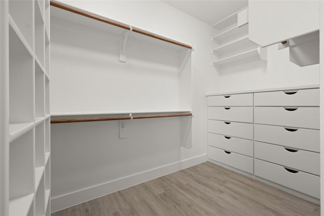 220 E 7th St, Weatherford, TX 76086 - walk in closet featuring light wood finished floors