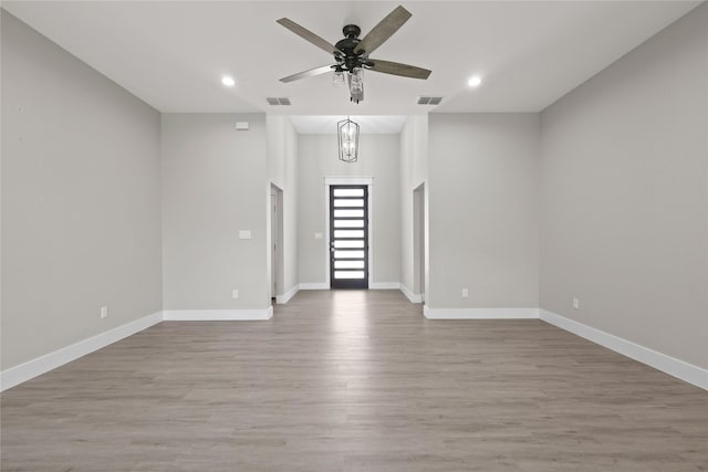 220 E 7th St, Weatherford, TX 76086 - empty room with ceiling fan, wood finished floors, baseboards, and recessed lighting