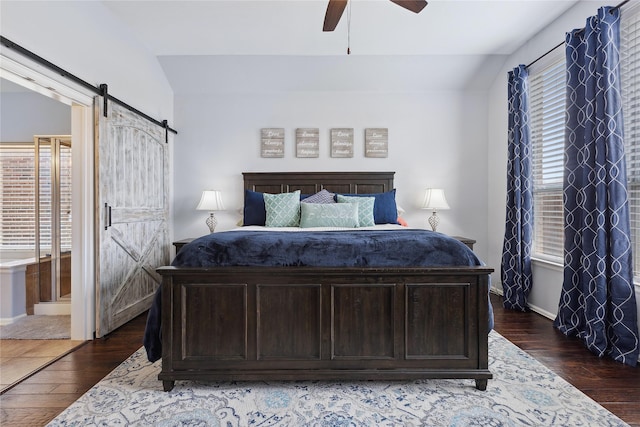 2800 Cedar Ridge Ln, Fort Worth, TX 76177 - bedroom with a barn door, wood finished floors, baseboards, and vaulted ceiling