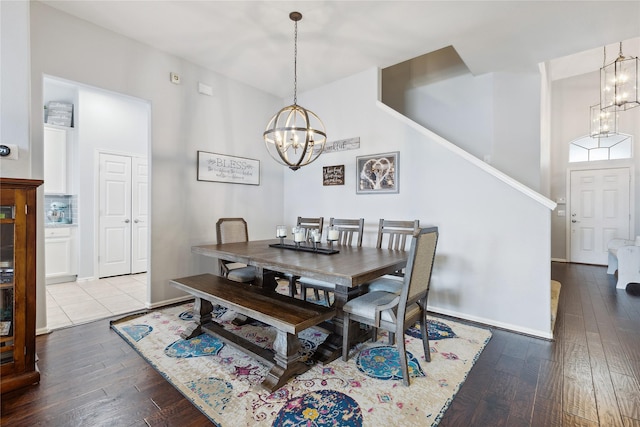2800 Cedar Ridge Ln, Fort Worth, TX 76177 - dining area with a chandelier, dark wood-type flooring, and baseboards