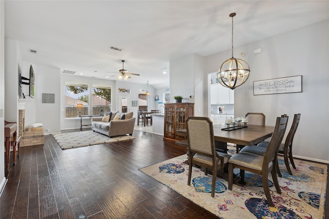 2800 Cedar Ridge Ln, Fort Worth, TX 76177 - dining area featuring dark wood finished floors, ceiling fan, a chandelier, and baseboards