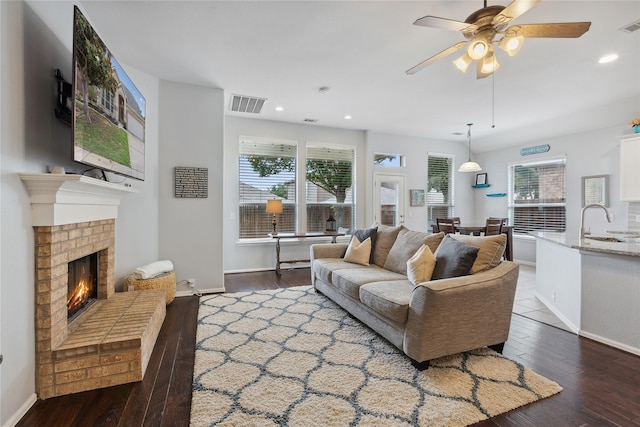 2800 Cedar Ridge Ln, Fort Worth, TX 76177 - living area featuring a brick fireplace, hardwood / wood-style flooring, plenty of natural light, ceiling fan, and recessed lighting