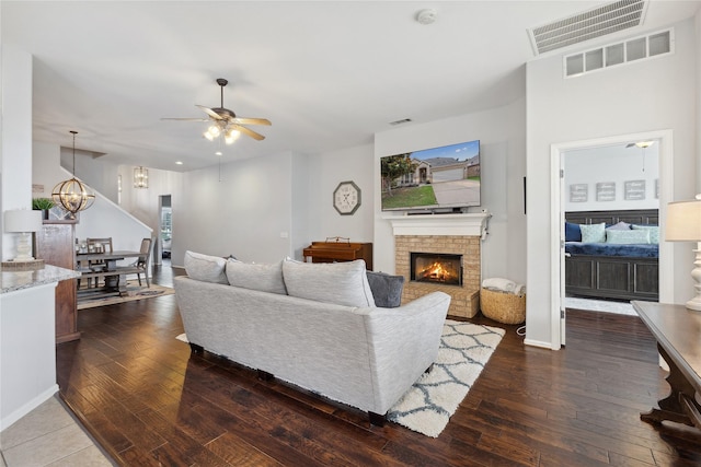 2800 Cedar Ridge Ln, Fort Worth, TX 76177 - living area with ceiling fan, hardwood / wood-style floors, a brick fireplace, and a chandelier