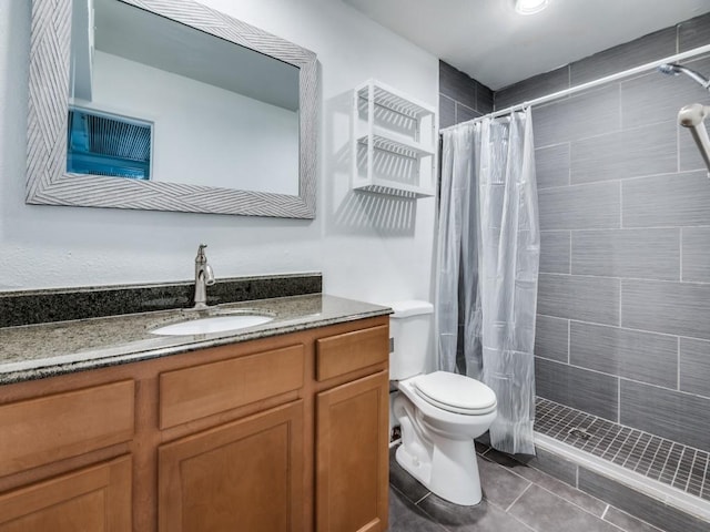 5234 Fleetwood Oaks Ave Unit 120, Dallas, TX 75235 - full bathroom with vanity, toilet, tiled shower, and tile patterned floors
