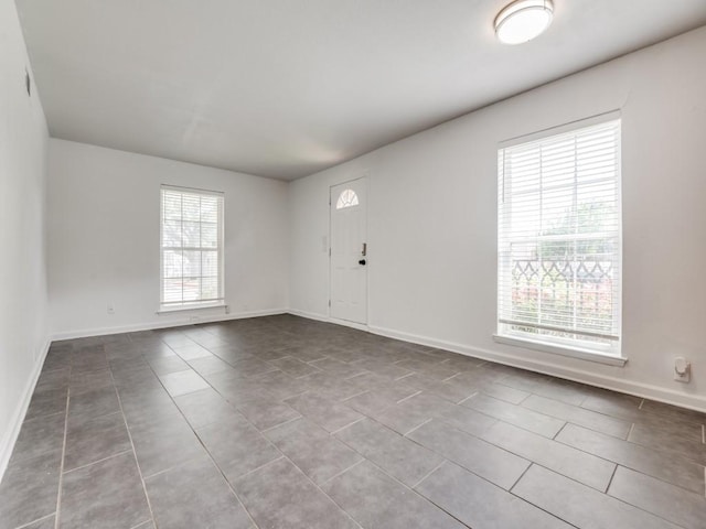 5234 Fleetwood Oaks Ave Unit 120, Dallas, TX 75235 - empty room with tile patterned floors and baseboards