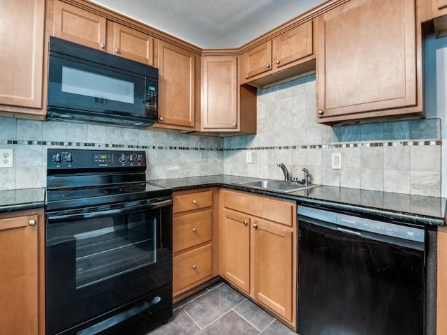 5234 Fleetwood Oaks Ave Unit 120, Dallas, TX 75235 - kitchen featuring black appliances, a sink, tasteful backsplash, tile patterned floors, and brown cabinets