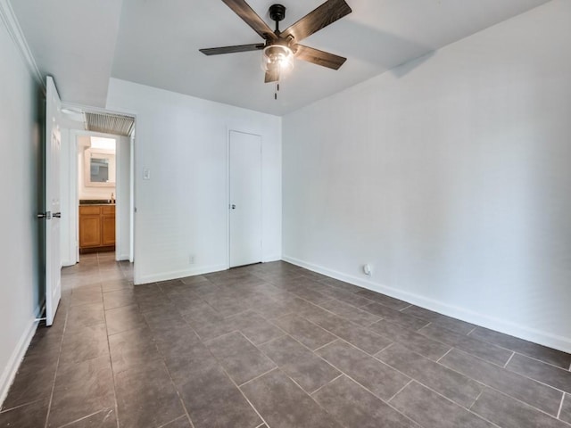 5234 Fleetwood Oaks Ave Unit 120, Dallas, TX 75235 - unfurnished bedroom with dark tile patterned flooring, baseboards, and a ceiling fan