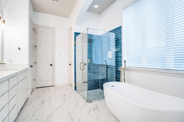 14669 Foxbriar Ln, Frisco, TX 75035 - full bath featuring a freestanding bath, vanity, a shower stall, and marble finish floors