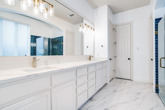 14669 Foxbriar Ln, Frisco, TX 75035 - bathroom featuring double vanity, a shower stall, and marble look tile flooring