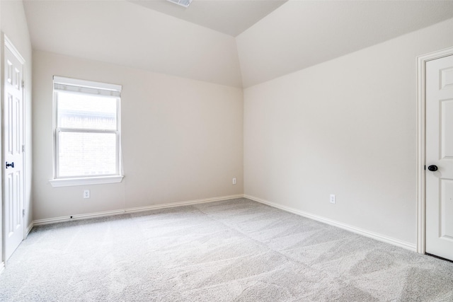 14669 Foxbriar Ln, Frisco, TX 75035 - unfurnished bedroom featuring light colored carpet, baseboards, and vaulted ceiling