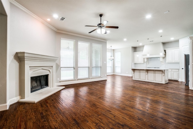 14669 Foxbriar Ln, Frisco, TX 75035 - unfurnished living room with ceiling fan, dark wood-style floors, a fireplace with raised hearth, baseboards, and recessed lighting