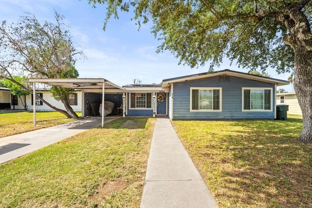 1011 Kleberg St, Alice, TX 78332 - view of front of property with a front yard, concrete driveway, and a carport