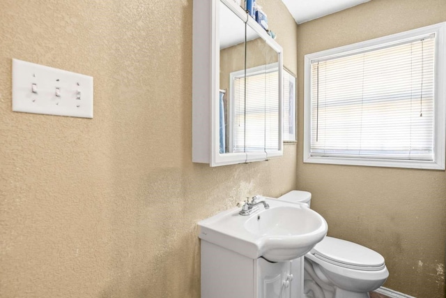 1011 Kleberg St, Alice, TX 78332 - bathroom featuring vanity and toilet