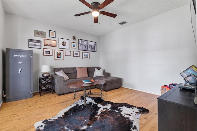736 Fawn Valley Dr, Allen, TX 75002 - living area with a ceiling fan and light wood-style floors