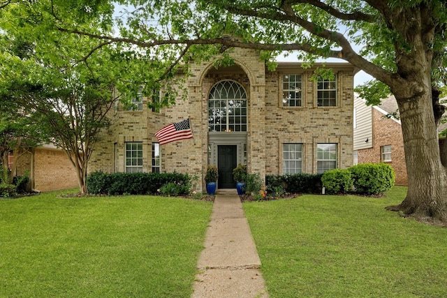 736 Fawn Valley Dr, Allen, TX 75002 - traditional-style house featuring brick siding and a front yard