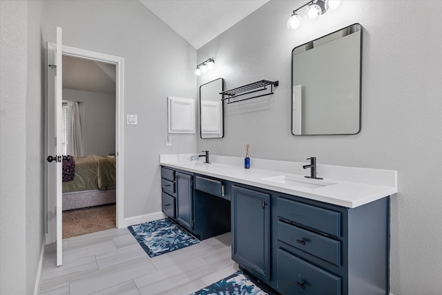 736 Fawn Valley Dr, Allen, TX 75002 - full bathroom featuring connected bathroom, double vanity, vaulted ceiling, and baseboards