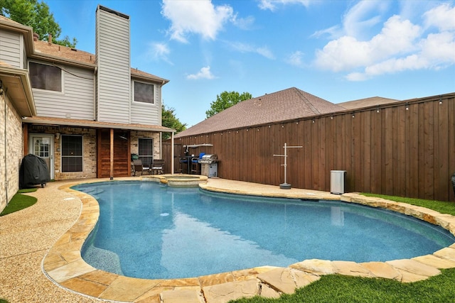 736 Fawn Valley Dr, Allen, TX 75002 - view of swimming pool with a fenced backyard, a pool with connected hot tub, a patio, and area for grilling