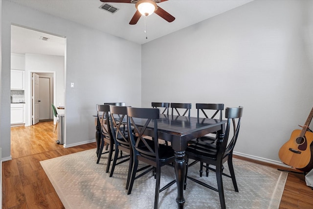 736 Fawn Valley Dr, Allen, TX 75002 - dining room featuring a ceiling fan, light wood-style floors, and baseboards