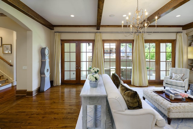 2905 Amherst Ave, University Park, TX 75225 - living room with beamed ceiling, stairway, dark wood-type flooring, arched walkways, and a chandelier