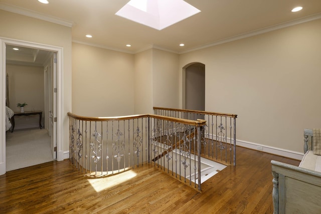 2905 Amherst Ave, University Park, TX 75225 - hall featuring an upstairs landing, wood finished floors, recessed lighting, crown molding, and a skylight