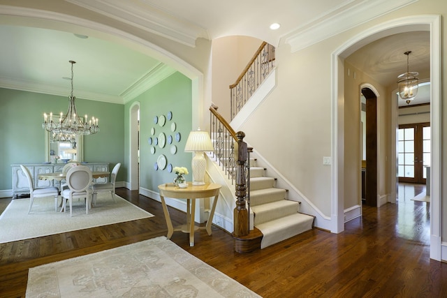 2905 Amherst Ave, University Park, TX 75225 - entryway with arched walkways, stairs, wood finished floors, a chandelier, and baseboards