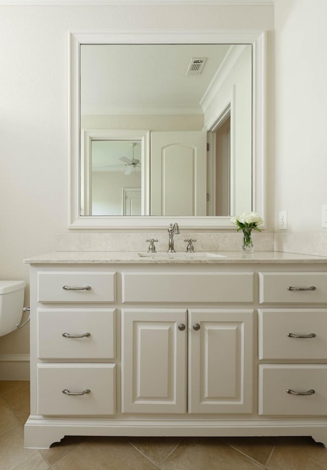 2905 Amherst Ave, University Park, TX 75225 - bathroom with tile patterned flooring, vanity, toilet, and ornamental molding