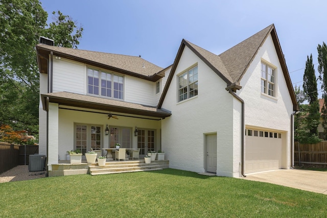 2905 Amherst Ave, University Park, TX 75225 - back of property featuring an attached garage, central AC unit, concrete driveway, a ceiling fan, and roof with shingles