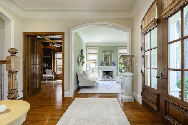 2905 Amherst Ave, University Park, TX 75225 - entrance foyer with arched walkways, french doors, baseboards, dark wood-style flooring, and crown molding