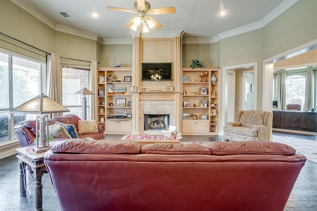 1717 Woodridge Ct, Aledo, TX 76008 - living room with plenty of natural light, a ceiling fan, ornamental molding, a tiled fireplace, and recessed lighting