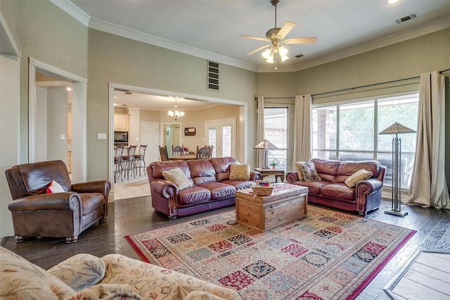 1717 Woodridge Ct, Aledo, TX 76008 - living room featuring healthy amount of natural light, wood finished floors, ceiling fan, ornamental molding, and a chandelier