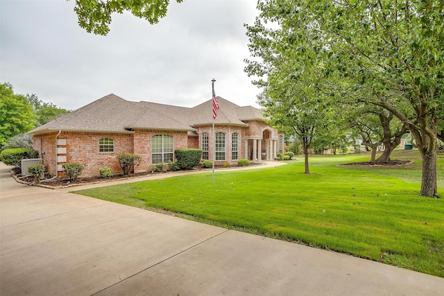 1717 Woodridge Ct, Aledo, TX 76008 - french country style house with brick siding, a front yard, and roof with shingles