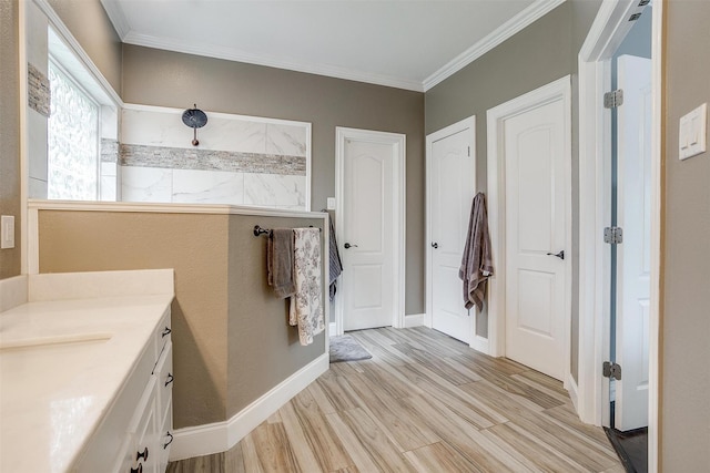 1717 Woodridge Ct, Aledo, TX 76008 - full bath featuring vanity, wood finished floors, ornamental molding, baseboards, and walk in shower