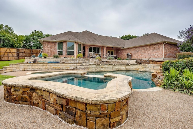 1717 Woodridge Ct, Aledo, TX 76008 - view of swimming pool featuring a patio and a pool with connected hot tub