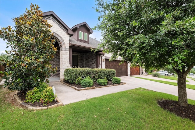 1108 Summer Ln, Mckinney, TX 75071 - view of front of house featuring driveway, a front lawn, brick siding, an attached garage, and stone siding