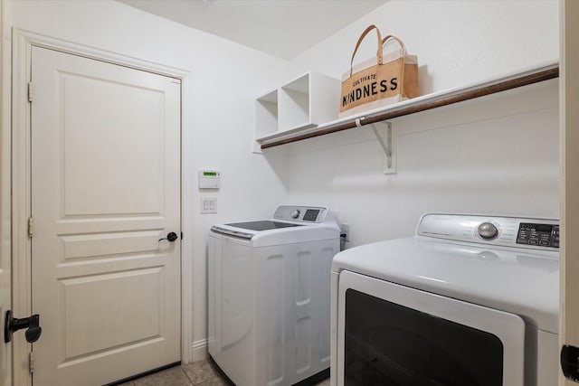1108 Summer Ln, Mckinney, TX 75071 - laundry area featuring washing machine and clothes dryer and light tile patterned floors