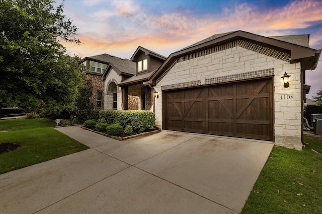 1108 Summer Ln, Mckinney, TX 75071 - view of front facade with stone siding, a garage, concrete driveway, brick siding, and a front yard