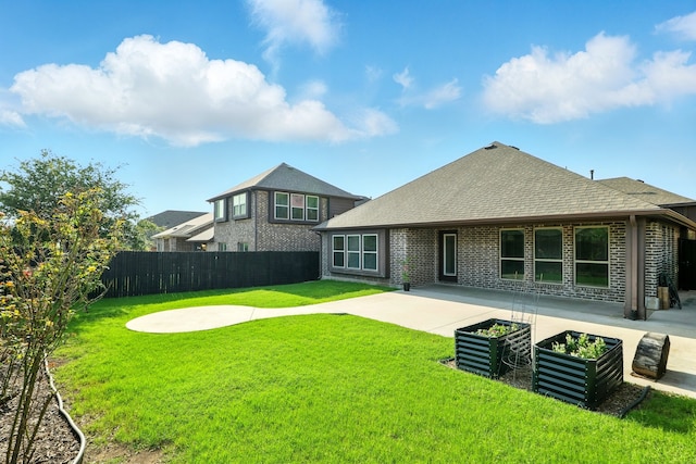1108 Summer Ln, Mckinney, TX 75071 - rear view of property featuring a patio, roof with shingles, and brick siding