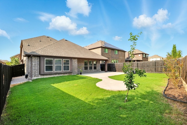 1108 Summer Ln, Mckinney, TX 75071 - rear view of house featuring a patio, a shingled roof, and brick siding