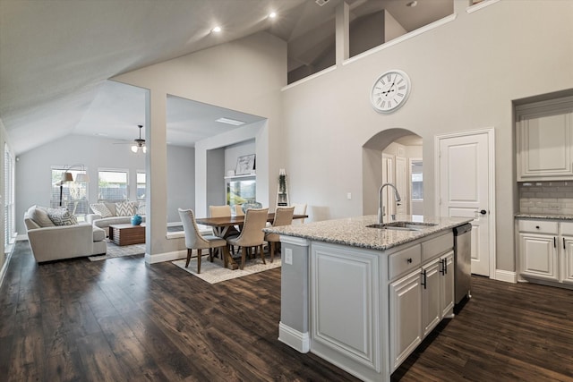 1108 Summer Ln, Mckinney, TX 75071 - kitchen with a sink, ceiling fan, dishwasher, arched walkways, and dark wood finished floors