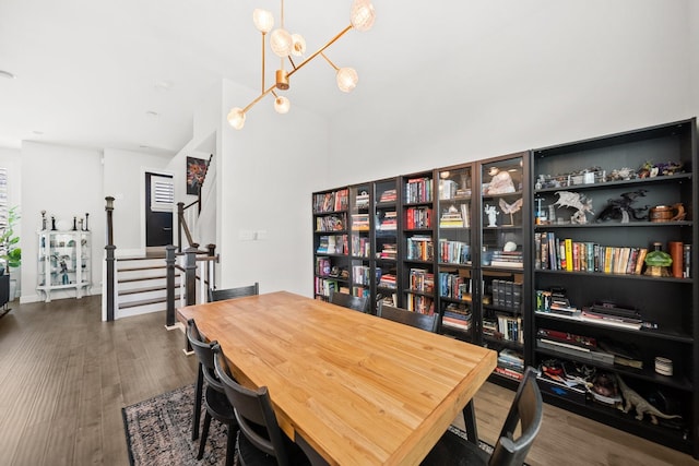 1844 Stevens Bluff Ln, Dallas, TX 75208 - dining space with dark wood-style flooring, a chandelier, and stairway