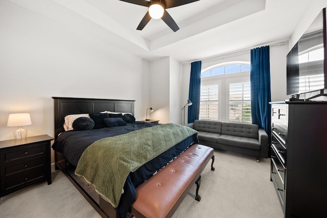 1844 Stevens Bluff Ln, Dallas, TX 75208 - bedroom featuring light carpet, a tray ceiling, and a ceiling fan