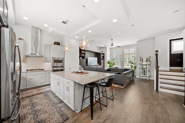 1844 Stevens Bluff Ln, Dallas, TX 75208 - kitchen featuring range hood, stainless steel appliances, a center island, healthy amount of natural light, and recessed lighting