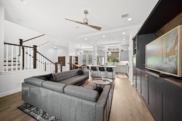 1844 Stevens Bluff Ln, Dallas, TX 75208 - living room with ceiling fan, light wood-type flooring, recessed lighting, stairs, and baseboards