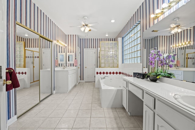 205 Lovegrass Ln, Southlake, TX 76092 - bathroom featuring wallpapered walls, a ceiling fan, a garden tub, tile patterned flooring, and two vanities