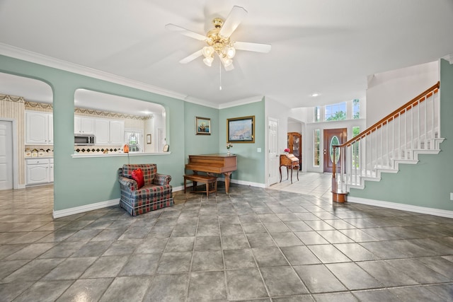 205 Lovegrass Ln, Southlake, TX 76092 - tiled entryway featuring ceiling fan, ornamental molding, and stairway