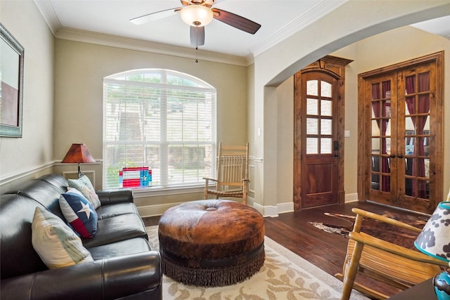 809 Cimmarron Bay Dr, Runaway Bay, TX 76426 - living room with arched walkways, hardwood / wood-style flooring, ceiling fan, crown molding, and baseboards